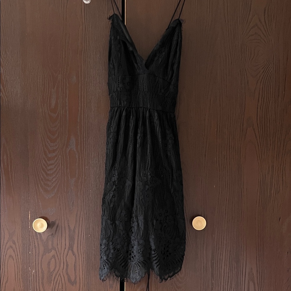 Aooksmery black thinly strapped black dressy dress. Lace up tie. Size Small. NWT